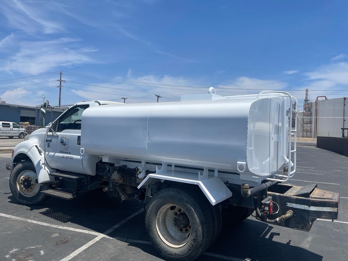 Custom water truck tank mounted on commercial chassis