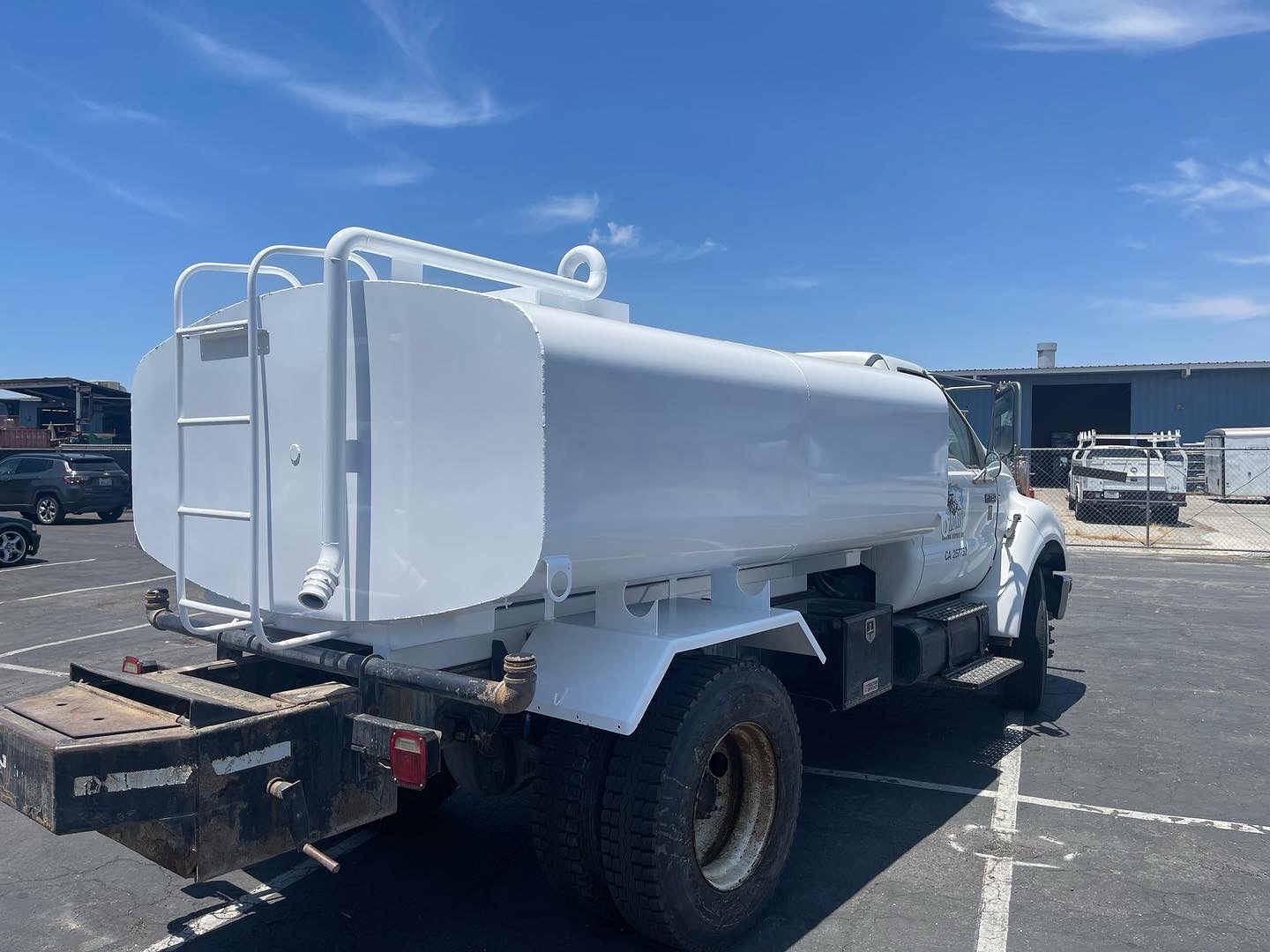 Rear three-quarter view of fabricated water truck tank