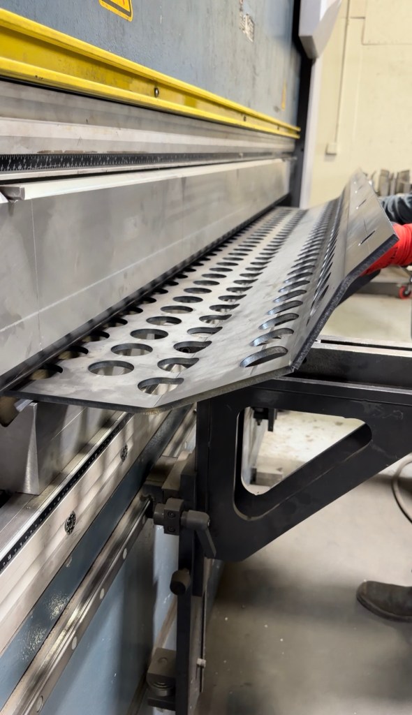Precision formed metal panel with repeated cutouts
