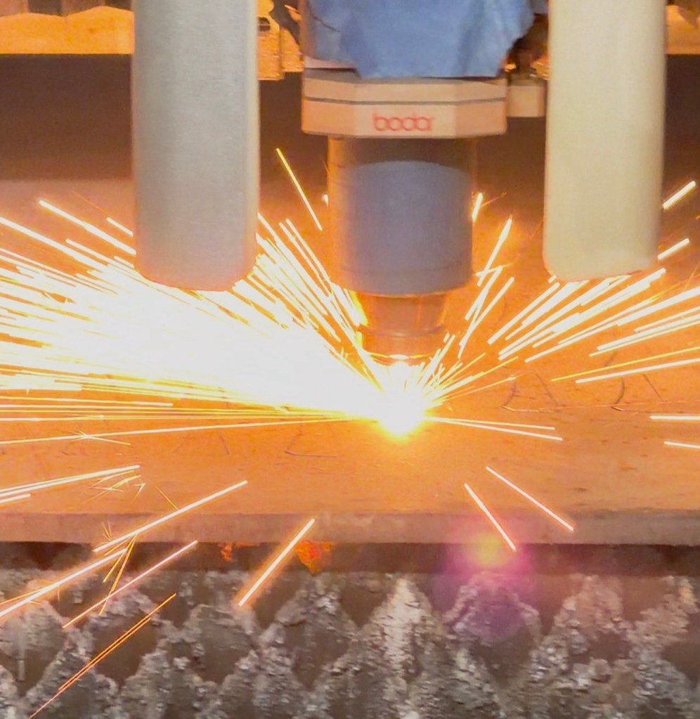 12 kW Bodor laser cutting steel plate with sparks