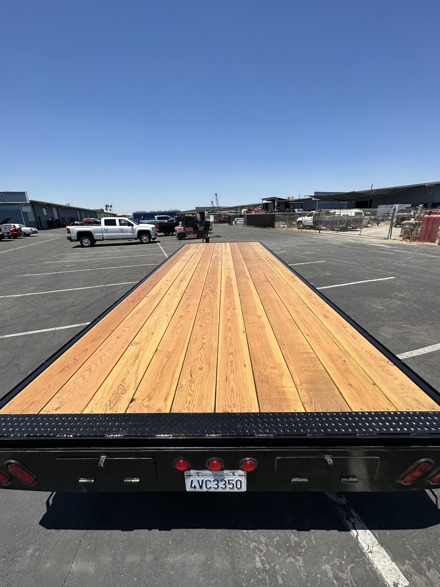 Wood decking on a fabricated flatbed equipment trailer