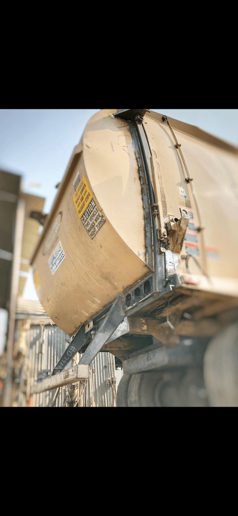 Exterior repair work on a sanitation truck body