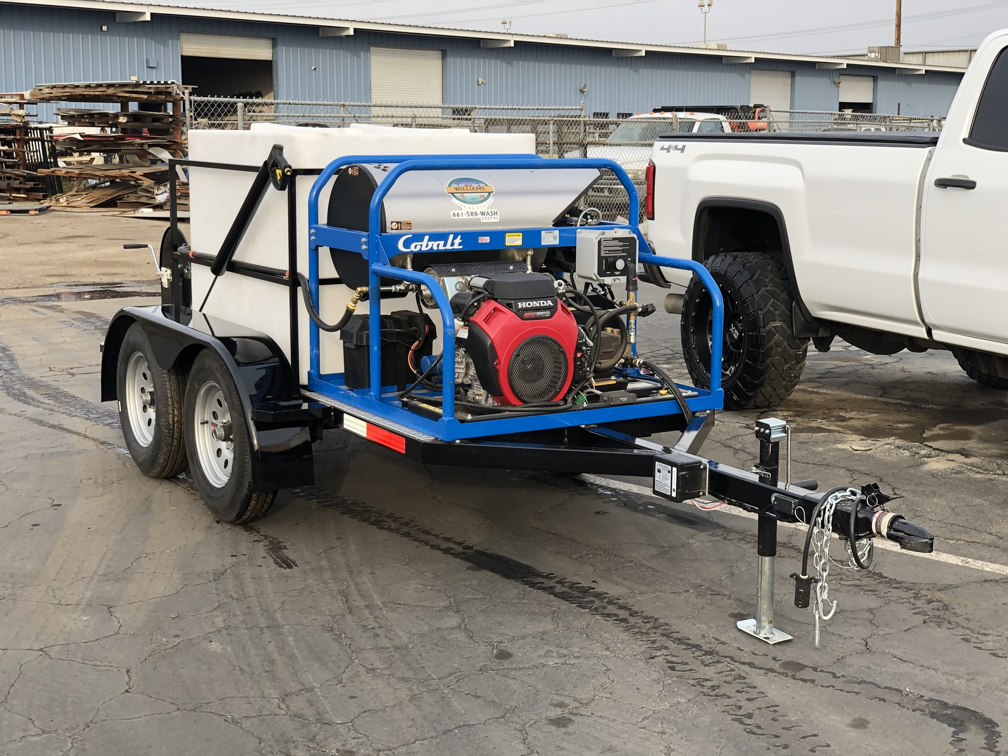 Custom pressure washer trailer with water tank and equipment fabricated by C3H Solutions