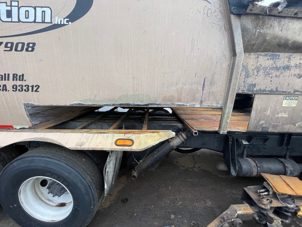 Steel repair and fitting on a refuse truck body