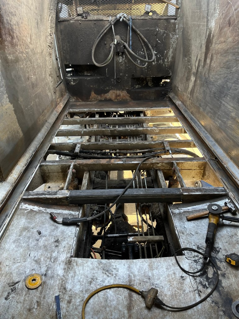 Fabricated steel components for sanitation truck repair