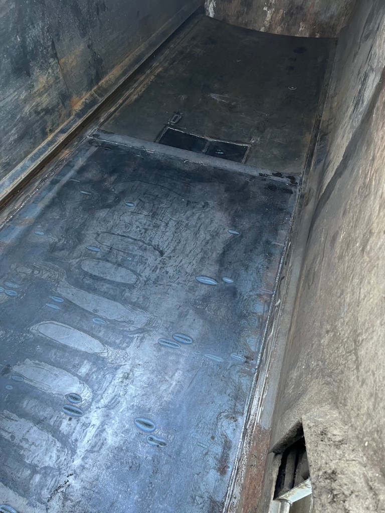 Sanitation truck body floor repair in progress