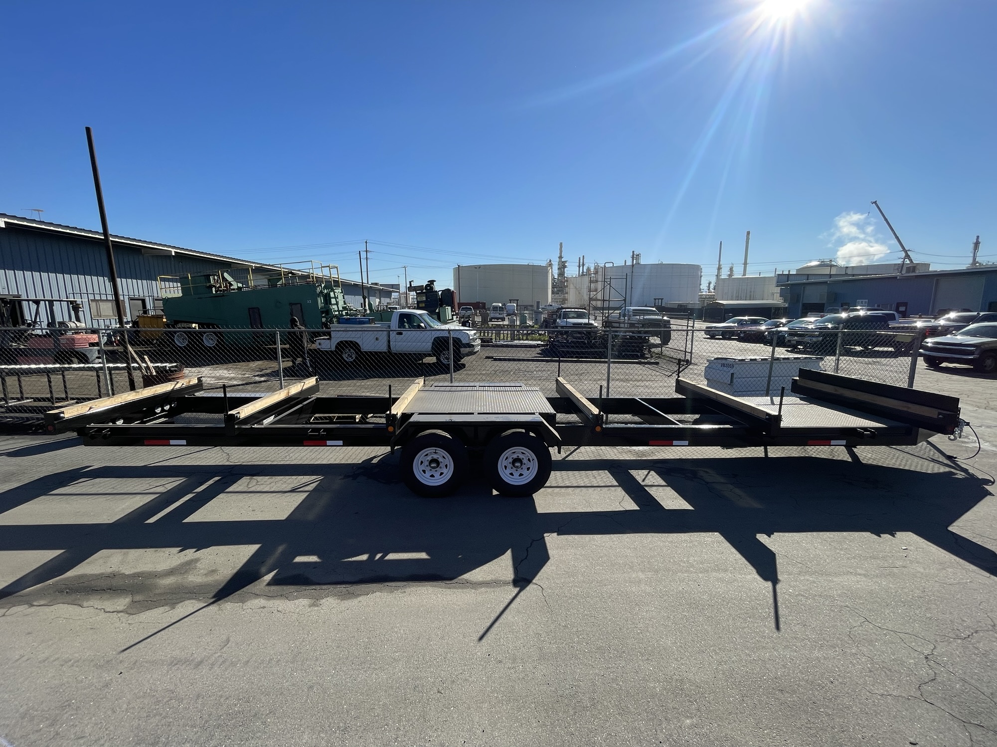 Side view of custom flatbed trailer with fabricated deck