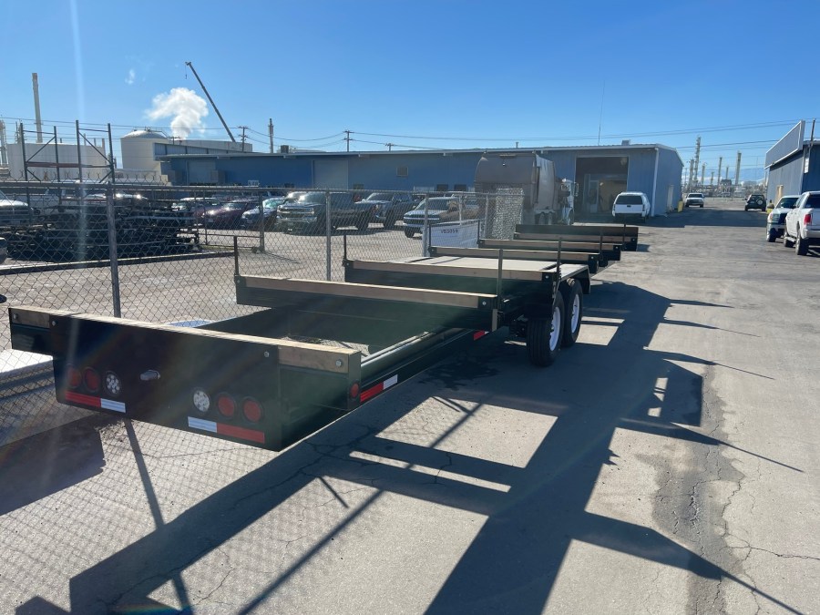 Rear view of a C3H custom dual-axle flatbed trailer
