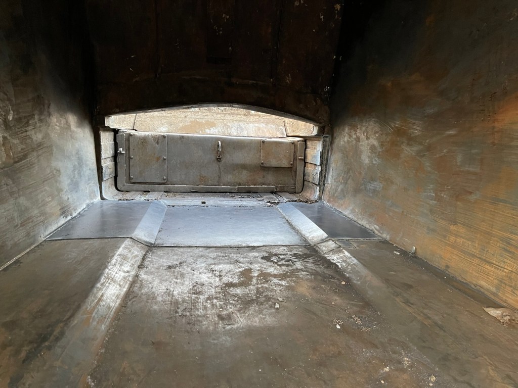 Interior view of repaired sanitation truck body metalwork
