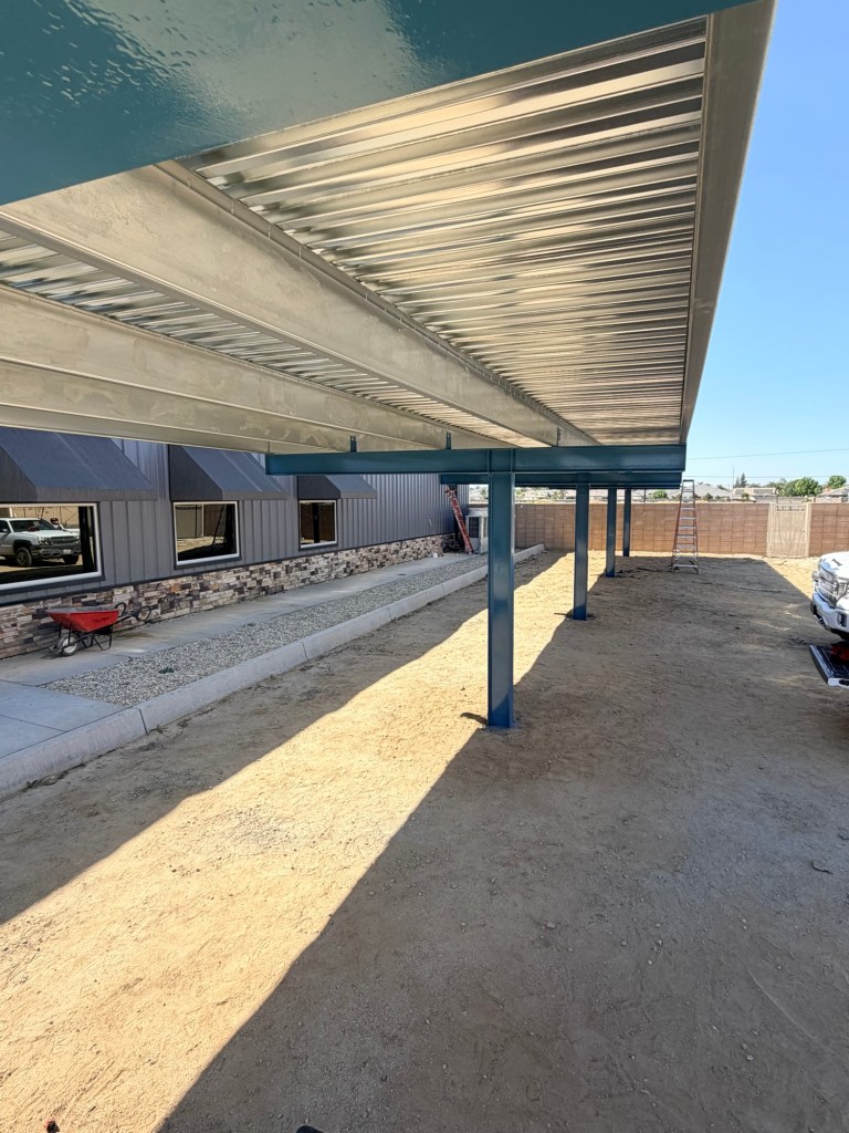 Installed steel canopy structure with roof decking