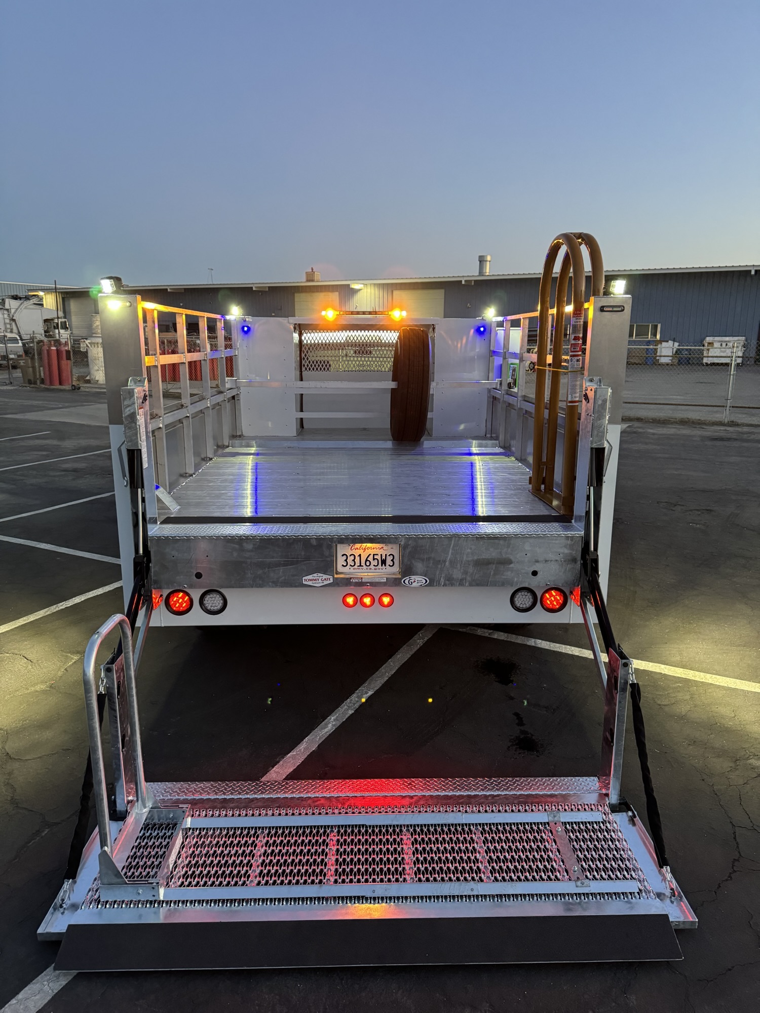 Tire service body with work lights and rear equipment mounts