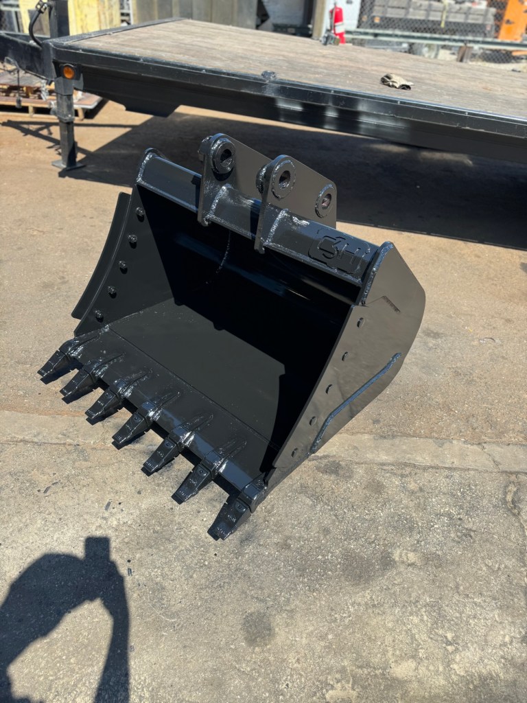 Black excavator bucket with teeth and reinforced structure