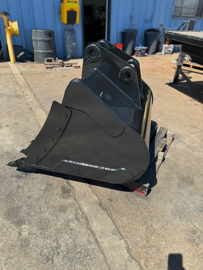 Custom excavator bucket shown from the side